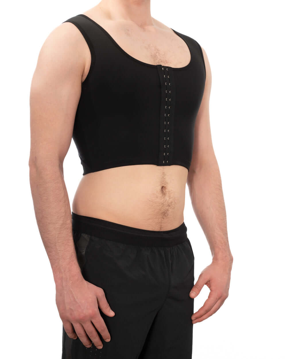 Man wearing a black Compression Chest Binder for firm, comfortable support and discreet chest flattening.