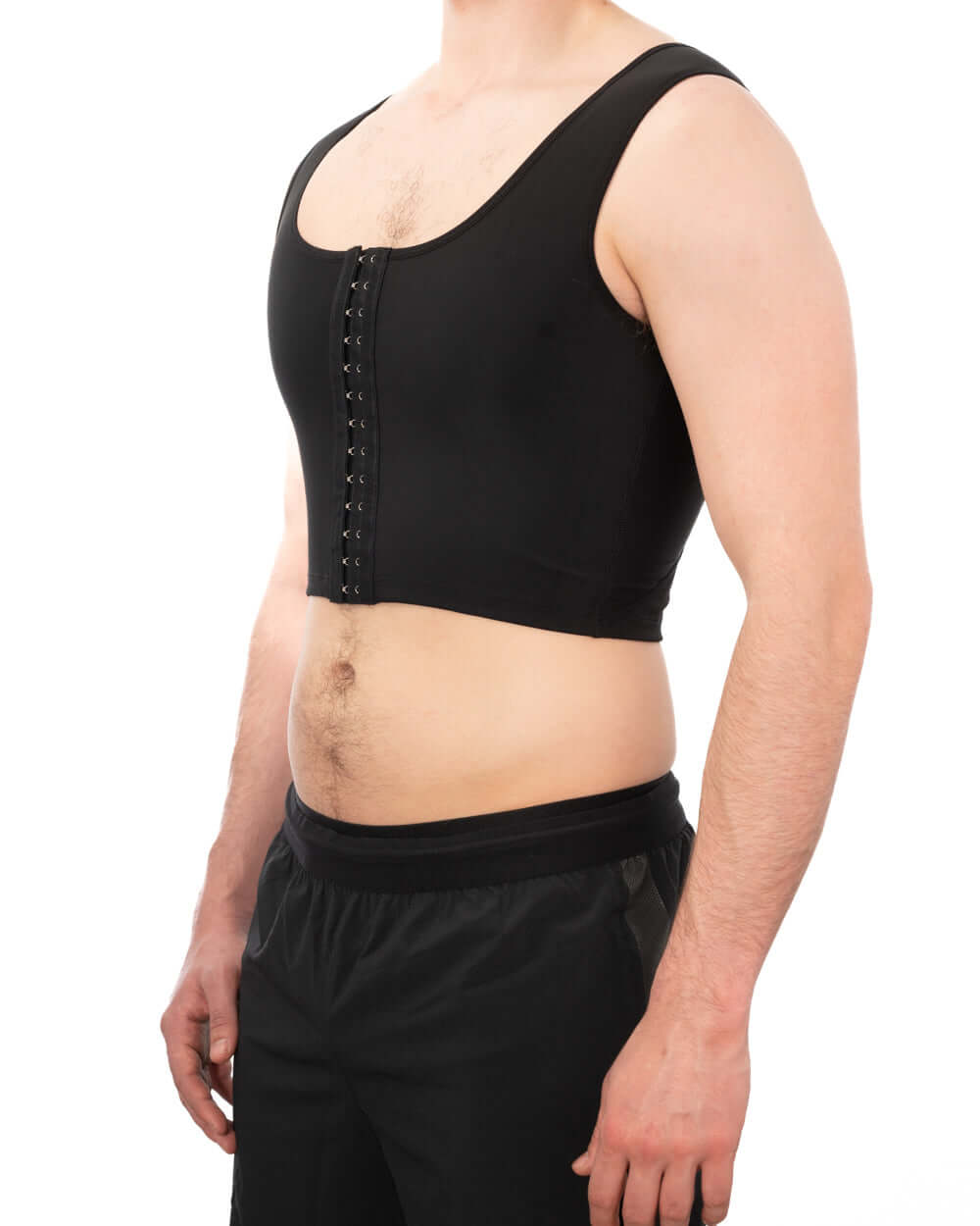 Black compression chest binder with adjustable clasps, designed for comfort and discretion.