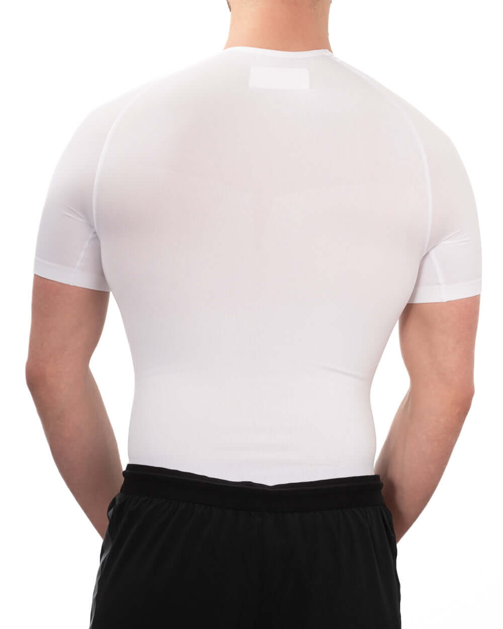 Back view of a men's seamless compression shirt in white, designed for support and comfort.