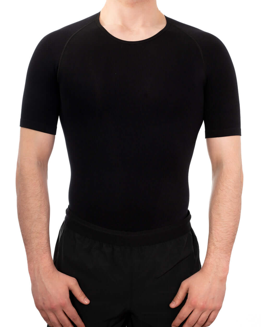 Men's seamless compression shirt in black, designed for comfort and support, ideal for hiding body imperfections.