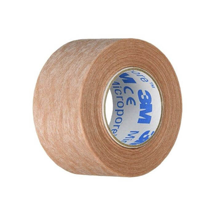 Micropore tape roll ideal for discreetly flattening gynecomastia under clothing.